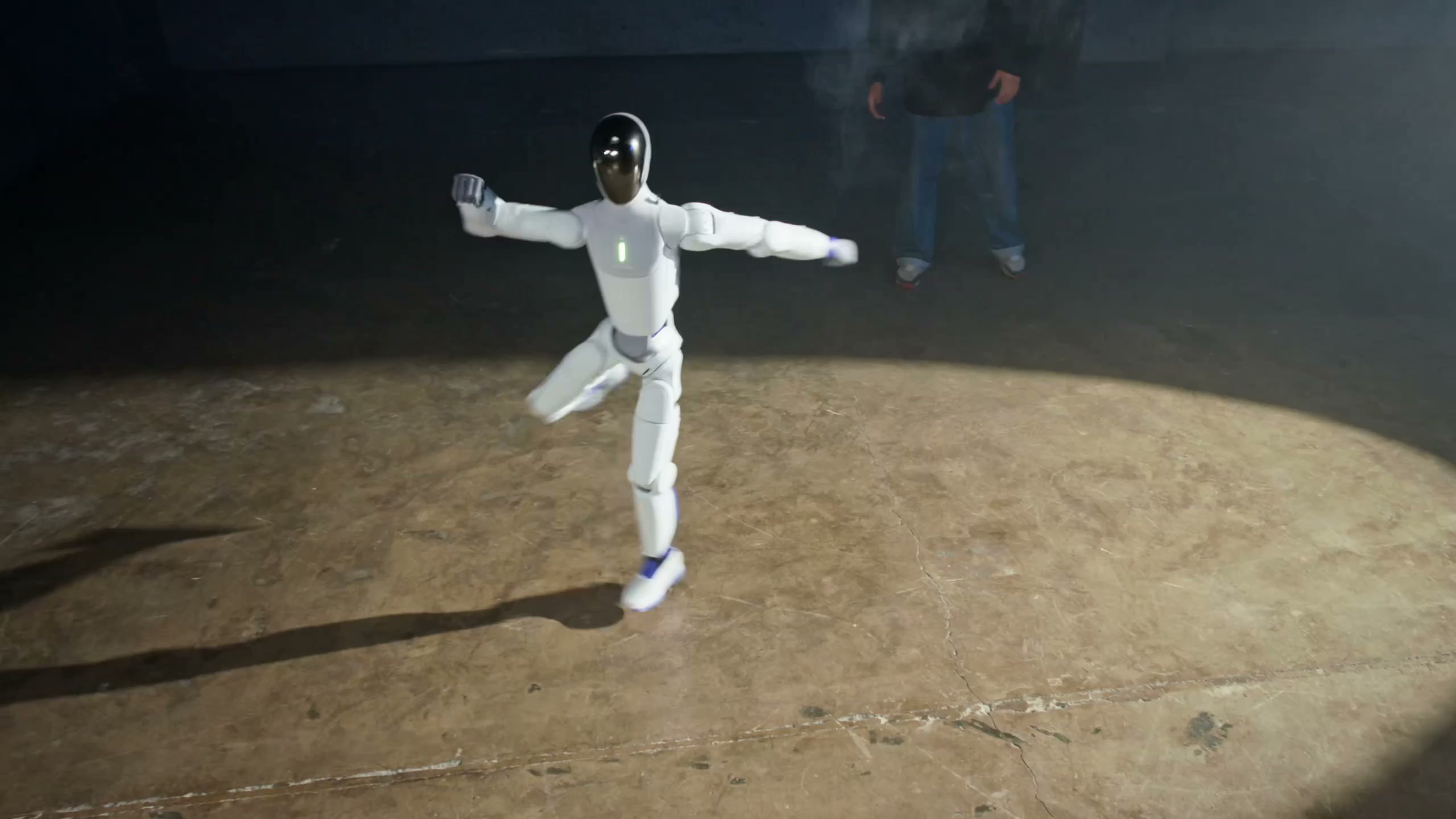 Humanoid robot in a public plaza at night